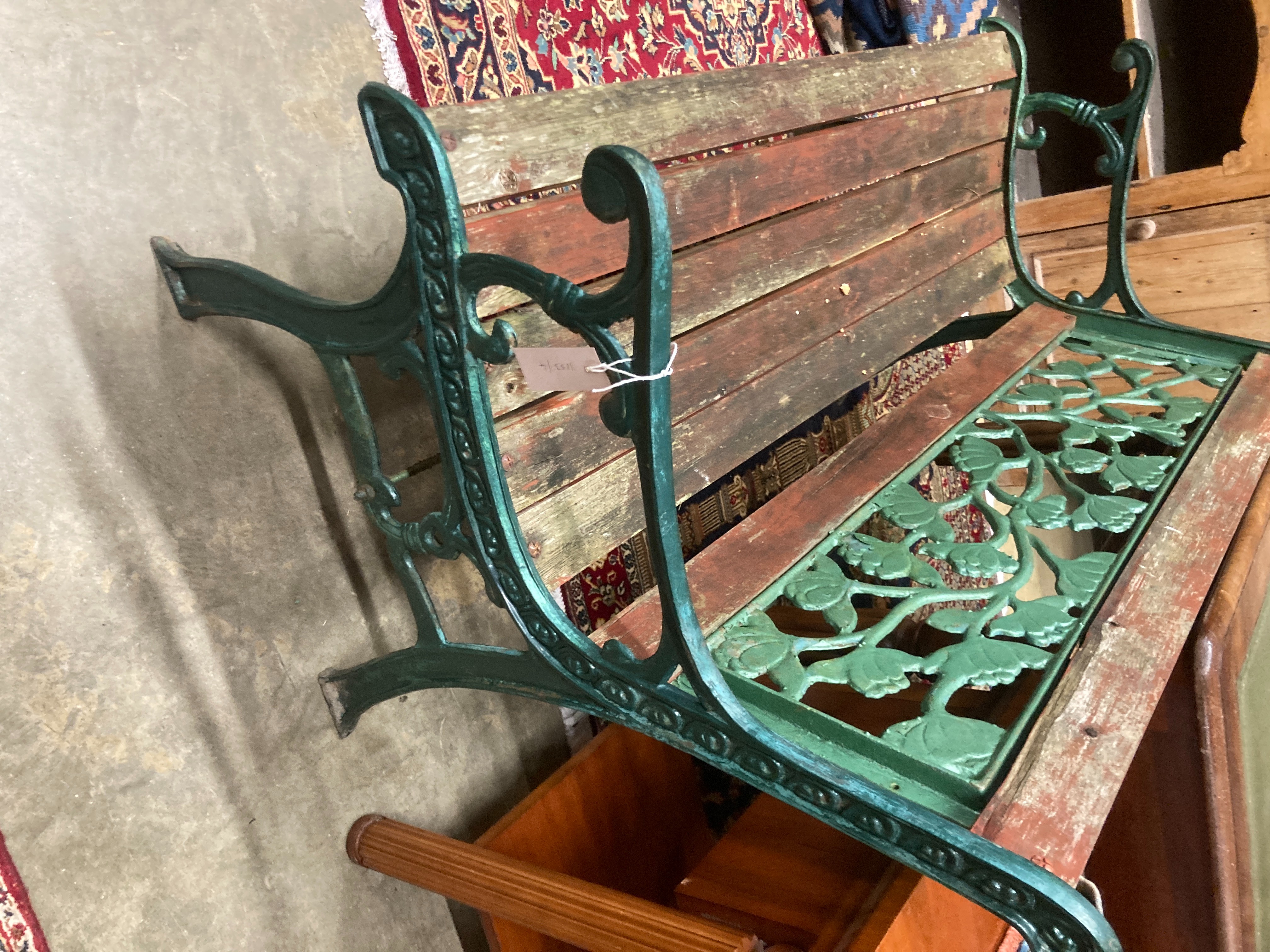 A cast iron and wood garden bench